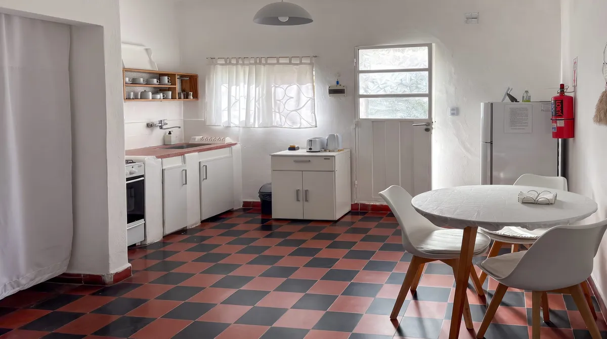 Kitchen with a gas oven and a table to eat at