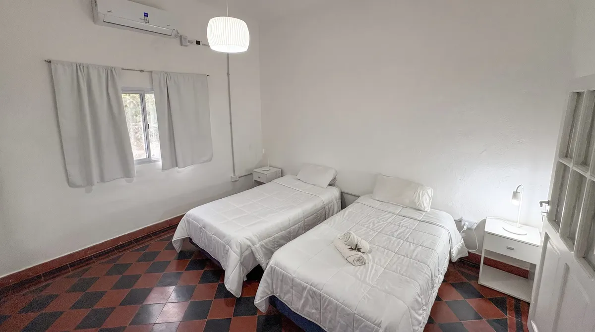 Second bedroom with two beds and heat-and-cool AC