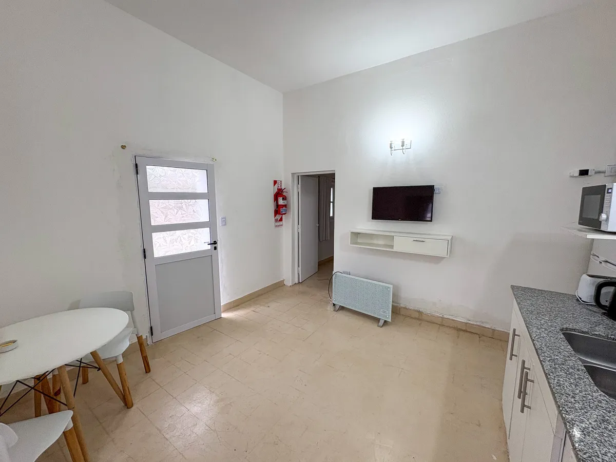 The other end of the living room, with Smart TV and heater