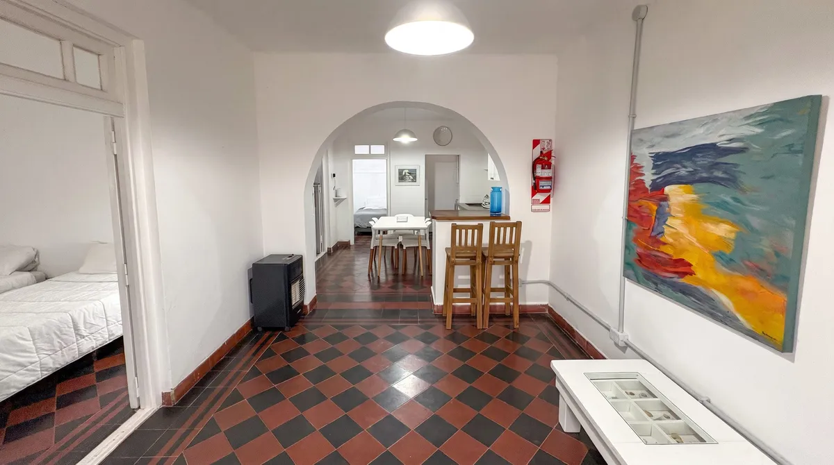The living room, with the arch and the breakfast bar